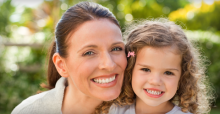 smiling mother and daughter